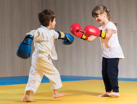 Young kids with boxing gloves trainingの写真素材
