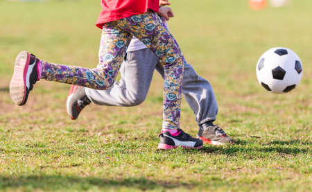 Kids soccer football - young children players match on soccer fieldの写真素材