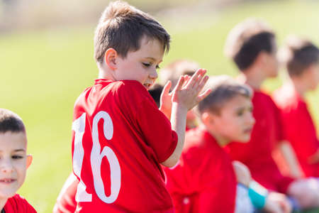 Young Boys In Football Team Celebratingの写真素材