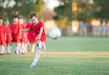 Kids soccer football - small children players exercising before match on soccer fieldのeditorial素材