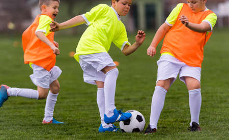Young children players match on soccer fieldの写真素材