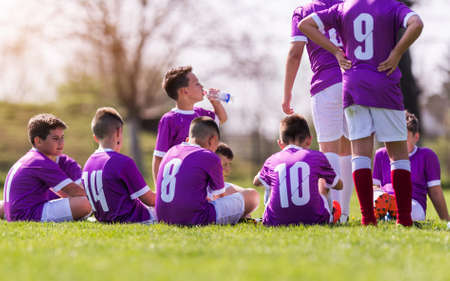 Young children player football match - waiting for match to startの写真素材