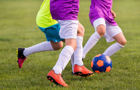Young children players match on soccer fieldの写真素材
