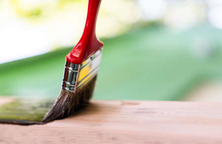 Paintin wooden surface with a brushの写真素材