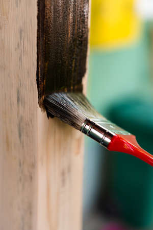 Paintin wooden surface with a brushの写真素材