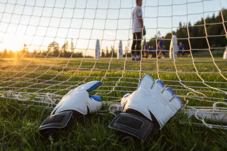 football game equipment gloves, on grass
