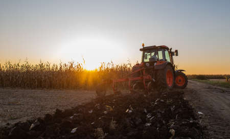 Tractor plowing fields -preparing land for sowing