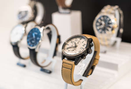Expensive watch is displayed for sale in luxury shop.