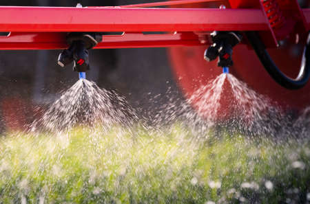 Nozzle of the tractor sprinklers sprayed.の写真素材