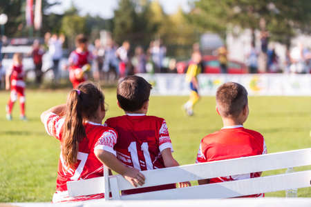 Soccer Team on the sidelines watching game.の写真素材