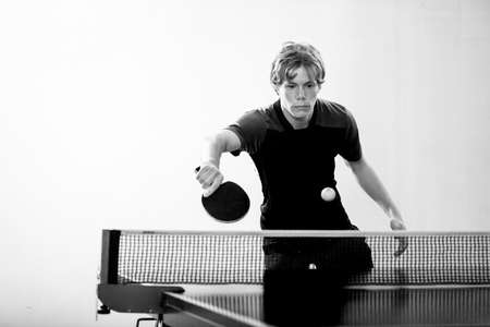 Teenager  playing  table tennis. Equipment, moving.の写真素材