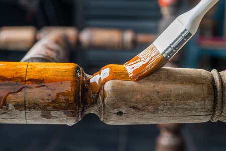 Renovation of old furniture. Home improvement concept with painting wooden surface.の写真素材