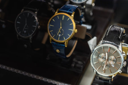 Luxury  watches on display in store window, shallow depth of field.