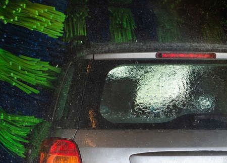 Grey car during washing process