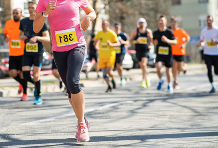Marathon running race, people feet on road.City â€‹â€‹marathon