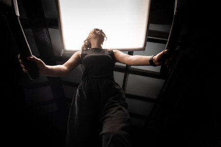 A beautiful athletic girl runs on a treadmill in a fitness club. Concept: cardio training, weight ,healthy lifestyle.の写真素材