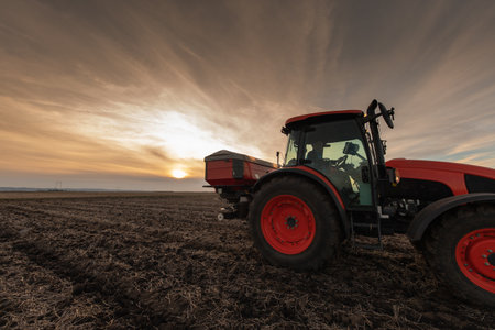 Tractor spreading artificial fertilizers. Transport, agricultural.