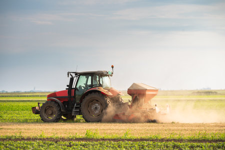 Agricultural machinery - Tractor and seeder for sowing cornの写真素材