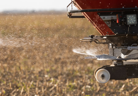 Tractor spreading artificial fertilizers. Transport, agricultural.