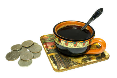 Cup of coffee with coins on a white backgroundの写真素材