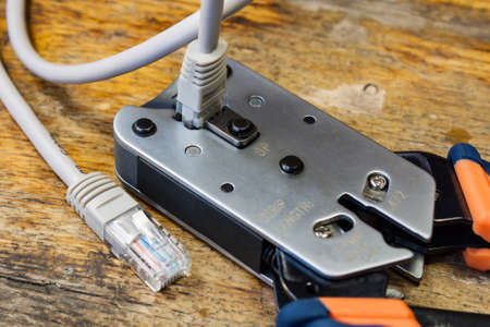 Crimping tool for mounting of the connectors RJ45 on the desktop in a workshop