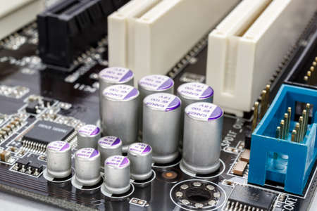 Group of electrolytic capacitors closeup on motherboardの写真素材