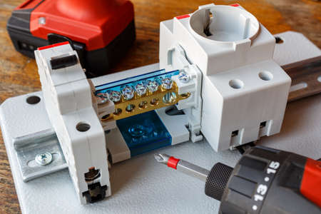 Circuit breaker with wire terminal block and electric socket on the DIN railの写真素材