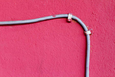 Ethernet cable attached to the wall. Abstract backgroundの写真素材
