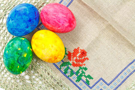 Easter eggs on a fabric with embroideryの写真素材