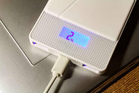 Power bank lying on the surface of the graphic tablet