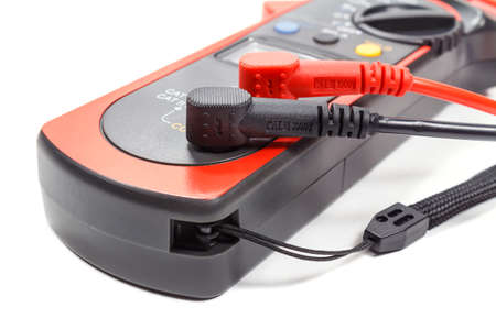 Digital clamp multimeter with probes on a white background