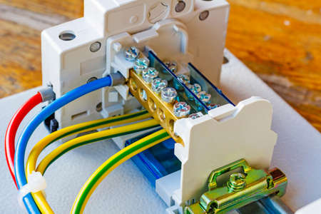Wire terminal with automatic circuit breaker installed on a DIN-rail