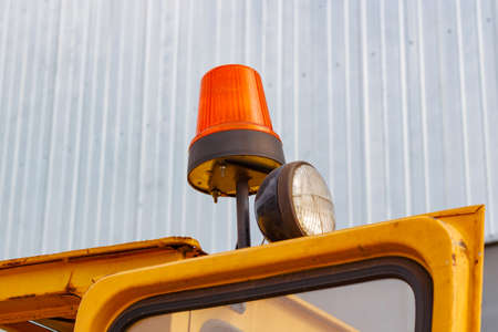 Orange flashing beacon on a forklift truck closeupの写真素材