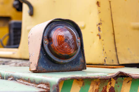 Turn signal indicator of a old forklift truck closeupの写真素材