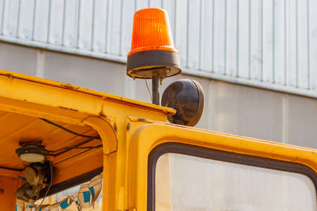 Orange flashing beacon on a forklift truck closeupの写真素材