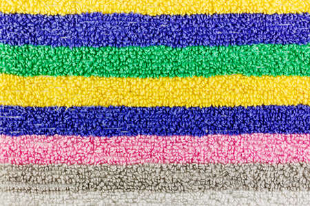 Texture of terry cloth with multi-colored stripes. Natural fabric backgroundの写真素材