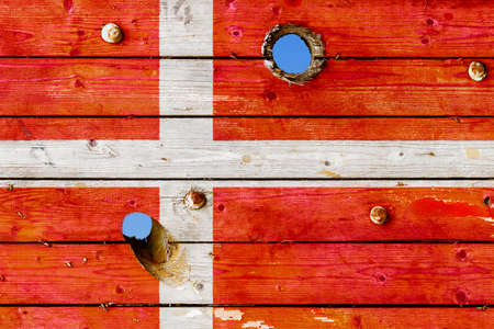 Danish flag painted on old weathered boardsの写真素材