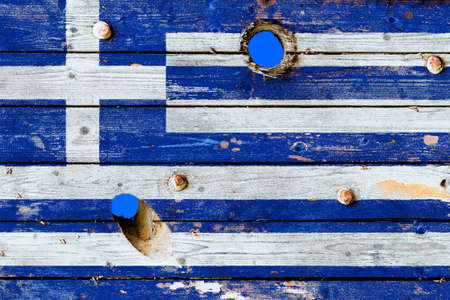 Greece flag painted on old weathered boardsの写真素材