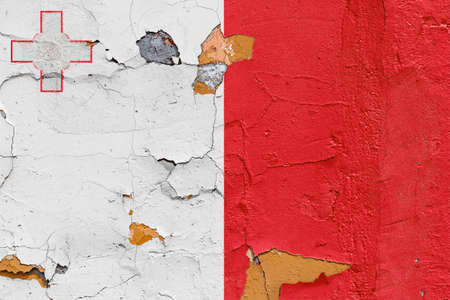 Malta flag painted on a weathered concrete wallの写真素材