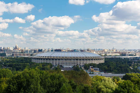MOSCOW, RUSSIA - AUGUST 12, 2017: Luzhniki sports complex on a sunny day. General view with Vorobyevy Goryのeditorial素材