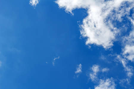 Clear blue sky with white cloud. Abstract sky background with copyspaceの写真素材