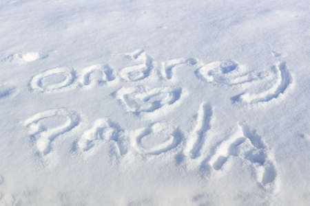 Text inscription on snow on a sunny winter dayの写真素材