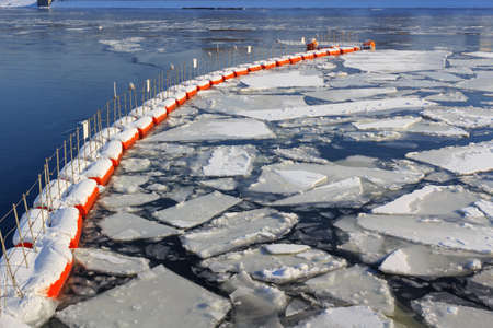 Broken ice on the surface of the river in winterの写真素材