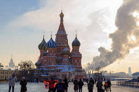 Moscow, Russia - February 14, 2018: Walking tourists on the Red Square against St. Basil's Cathedralのeditorial素材