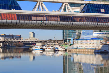 Moscow, Russia - April 14, 2018: Pleasure boats at the pier on the Moskva River near the International Business Center Moscow-Cityのeditorial素材