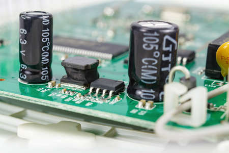 Printed circuit board with installed electronic components closeup