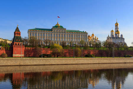 Grand Kremlin Palace and cathedrals with golden domes on the territory of Moscow Kremlin in sunny spring morningの写真素材
