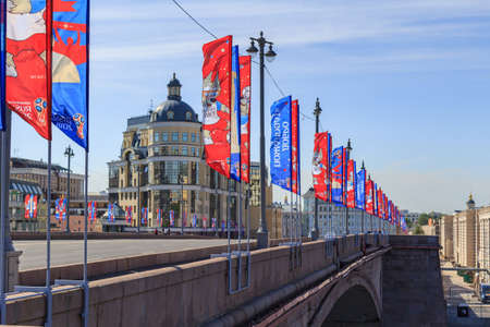 Moscow, Russia - June 03, 2018: Waving flags with symbols of FIFA World Cup Russia 2018 on Bol'shoy Moskvoretskiy bridge on a blue sky backgroundのeditorial素材
