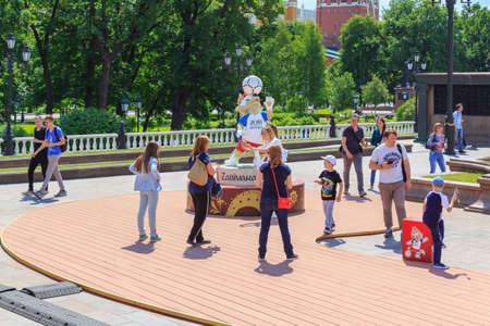 Moscow, Russia - June 03, 2018: Tourists taking photos with official symbol of FIFA World Cup Russia...