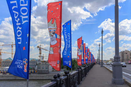 Moscow, Russia - June 03, 2018: Waving flags with symbols of FIFA World Cup Russia 2018 on Bol'shoy...